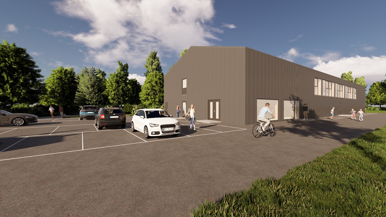 Außenansicht der neuen Turnhalle mit Parkplatz